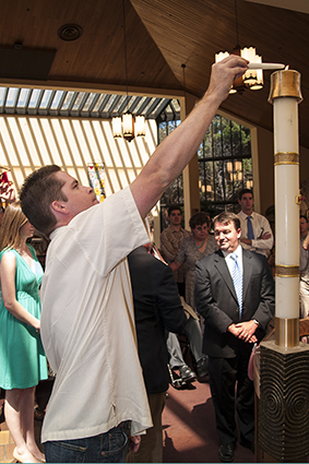 Tyler Baartholomew lighting candle